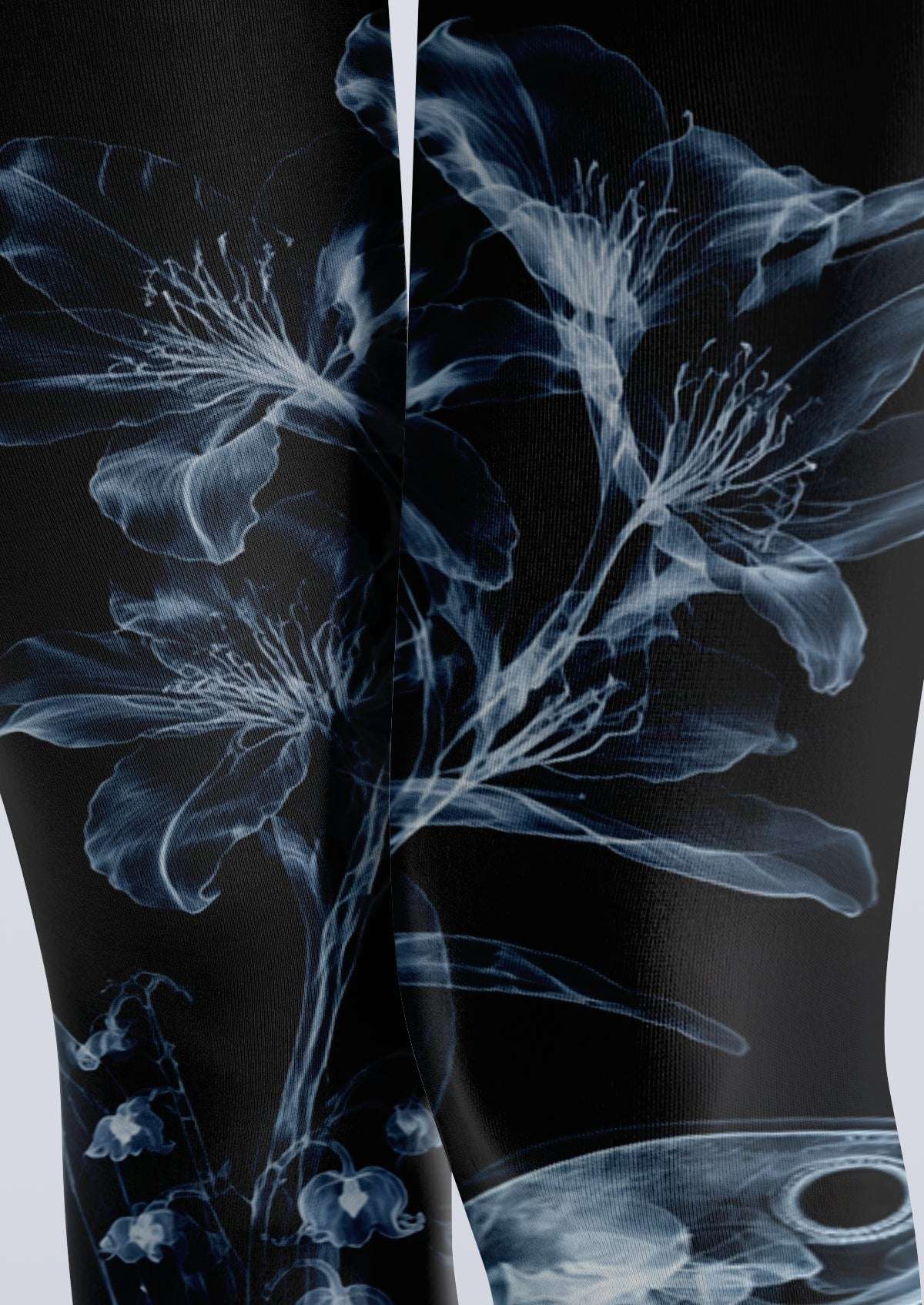 Avaeri black tights featuring a white X-ray-style floral and bird skeleton print, perfect for a dark romantic look.