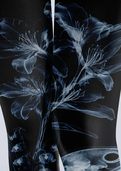 Avaeri black tights featuring a white X-ray-style floral and bird skeleton print, perfect for a dark romantic look.